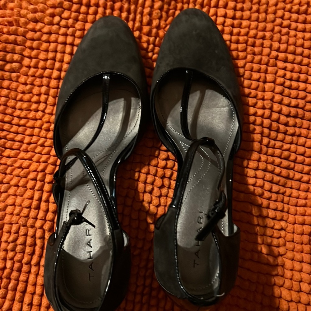 Gray and black t-strap heels.
